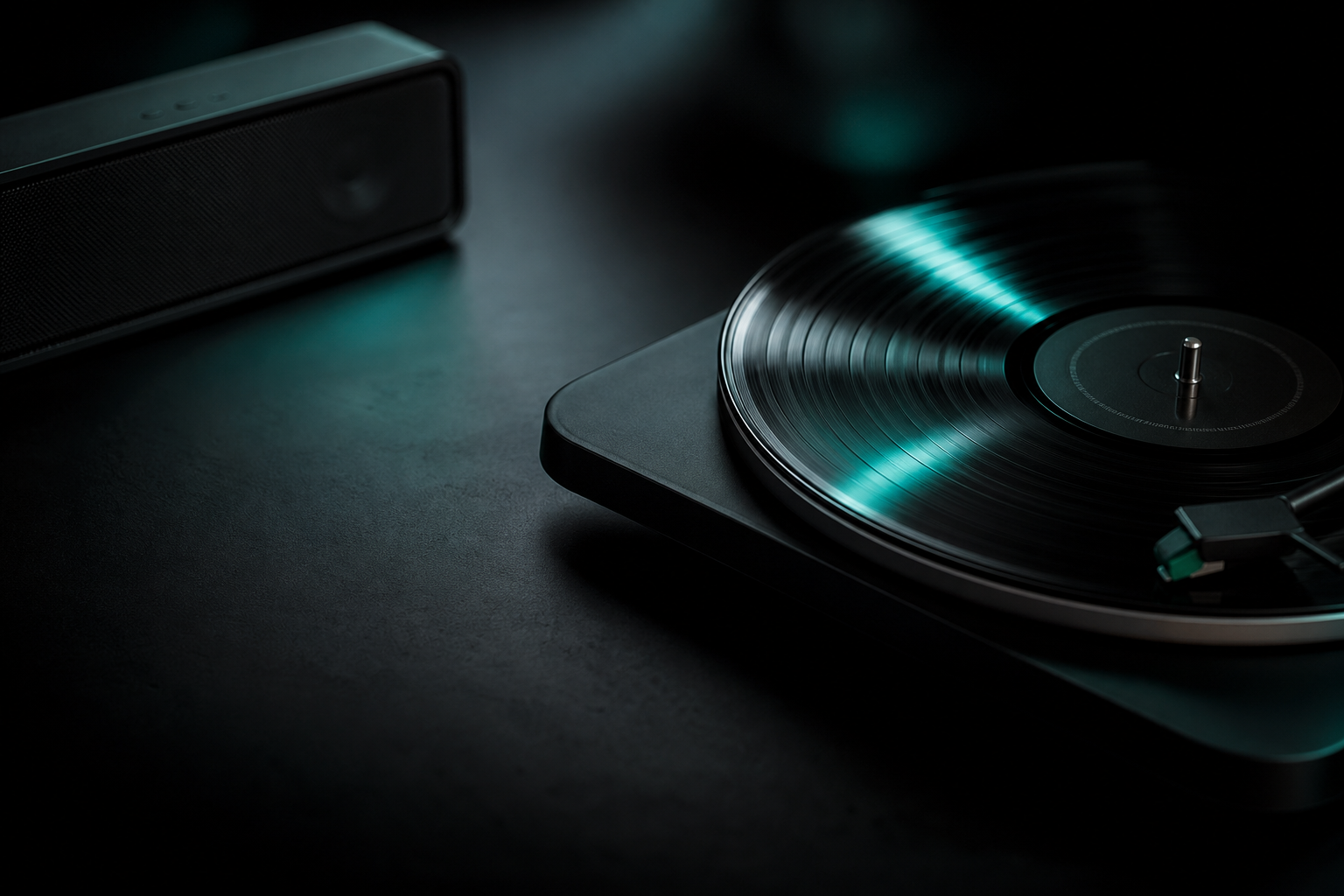 Vinyl record and speaker on a black surface with teal light reflections
